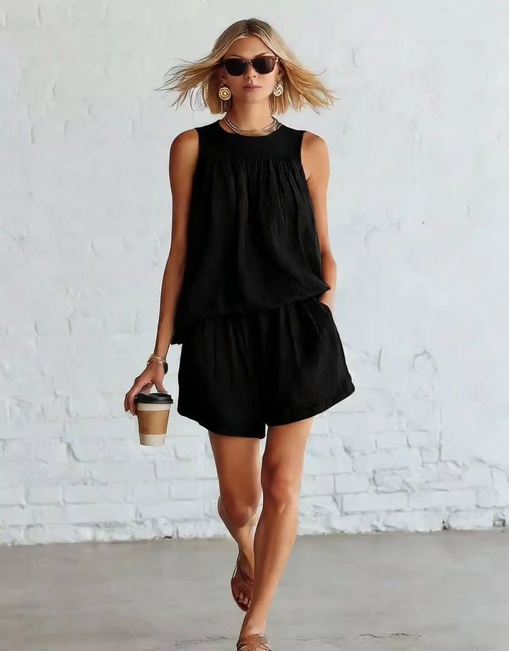 Coordinated women's fashion: Sleeveless gathered top & high-waisted shorts set. Casual daywear, summer style.