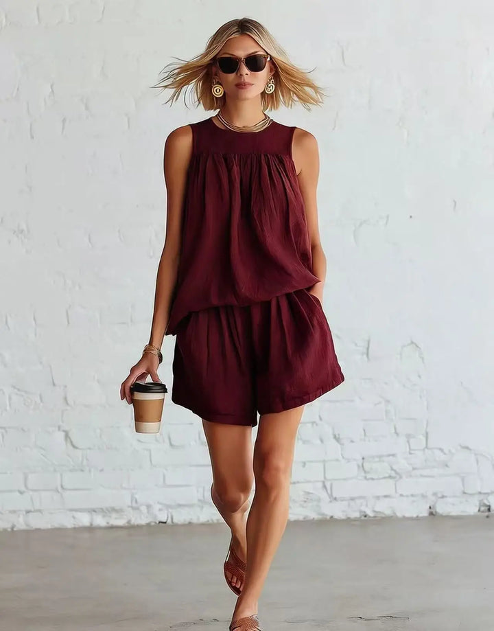 Women's chic casual shorts set featuring a gathered sleeveless top & high-waisted shorts. Ideal for summer.