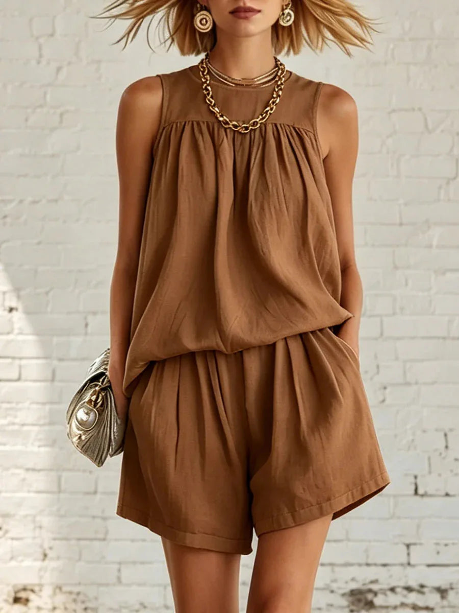 Stylish women's two-piece set: A gathered sleeveless top paired with comfy high-waisted shorts. Casual fashion.