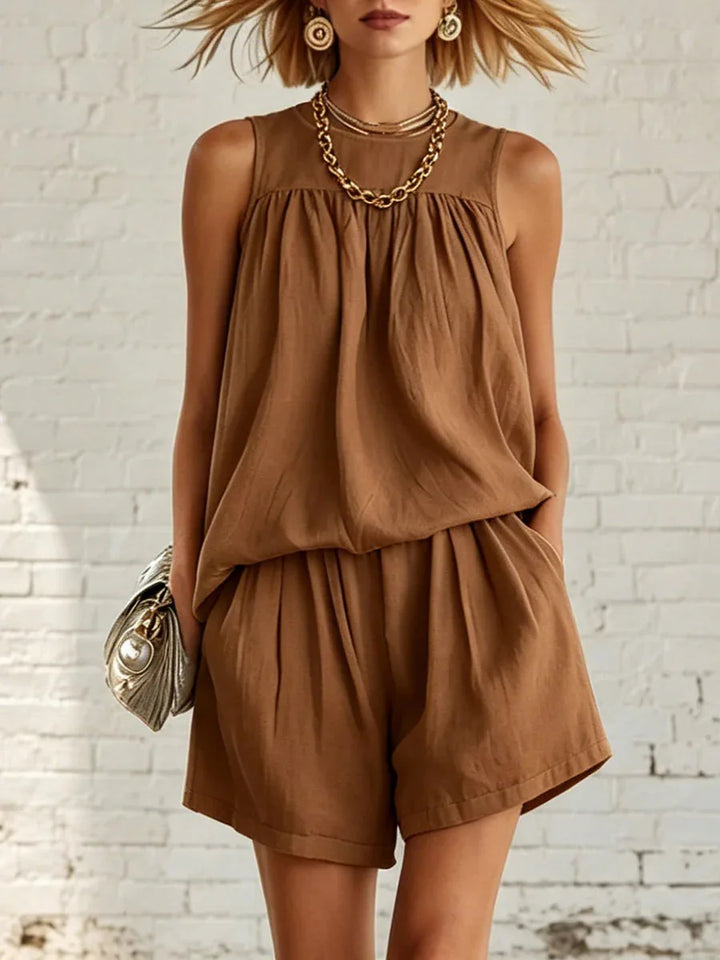 Stylish women's two-piece set: A gathered sleeveless top paired with comfy high-waisted shorts. Casual fashion.