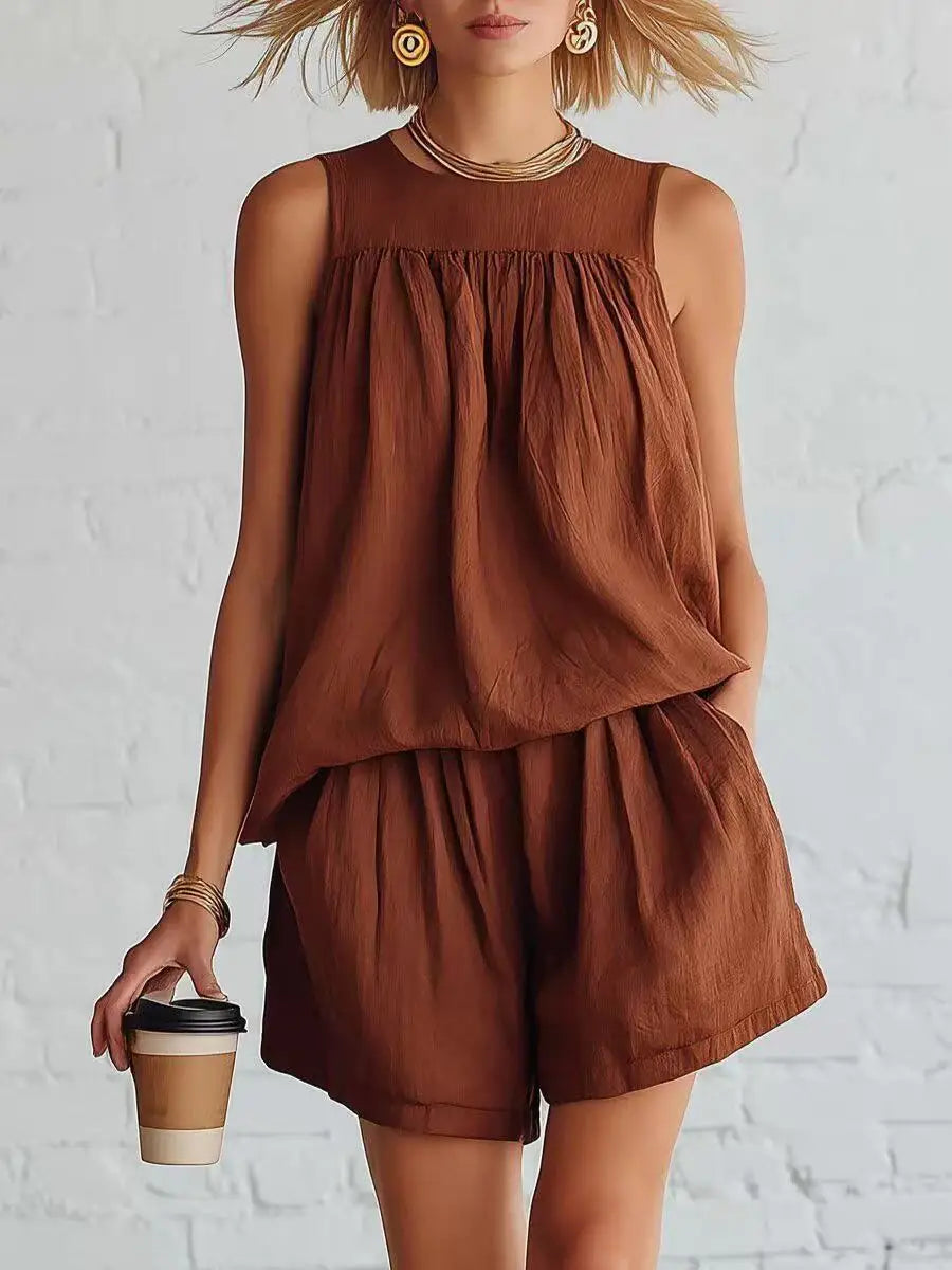 Women's casual daywear shorts set with a gathered sleeveless top & high-waisted shorts. Comfortable summer outfit.