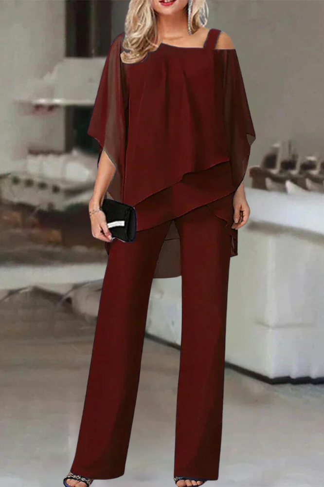 Stylish women's coordinated blouse and pants outfit. A comfortable, chic two-piece set for elegant everyday wear.