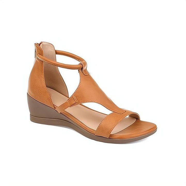 Ladies' comfortable flat sandals for warm weather. Chic everyday slip-on footwear, perfect for summer and casual styling.