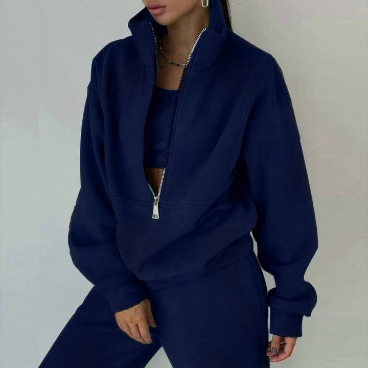Cozy women's two-piece sweatsuit: half-zip pullover & joggers. Versatile loungewear, travel, & casual athleisure.