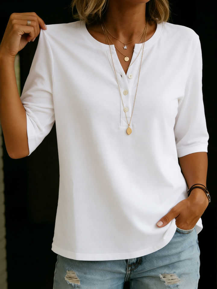 Relaxed fit women's blouse with a stylish notch neck and comfortable 3/4 sleeves, ideal versatile top.