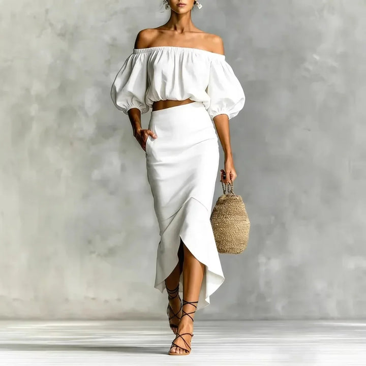 Elegant two-piece off-shoulder women's set with puff sleeve top & wrap midi skirt, ideal for brunch or summer events.