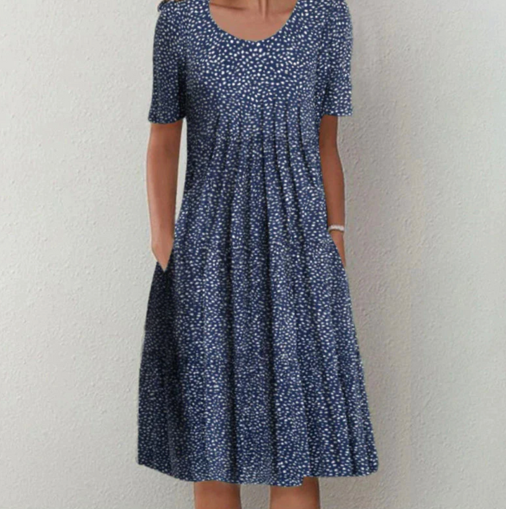 Comfortable A-line pleated midi dress for women, featuring a vibrant print ideal for warm weather.