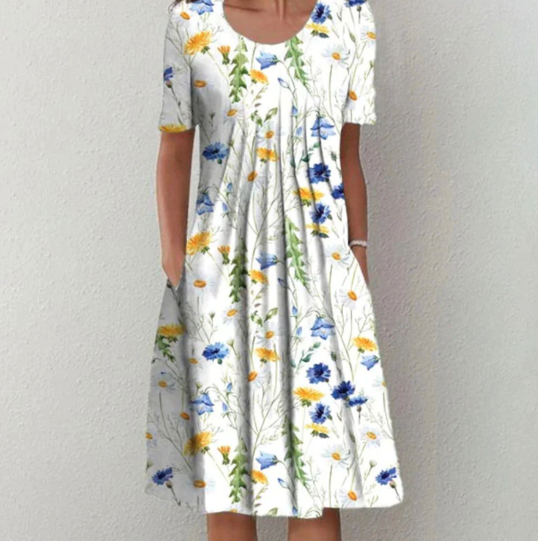 Elegant women's pleated A-line midi dress in a stylish print, a must-have for summer fashion.