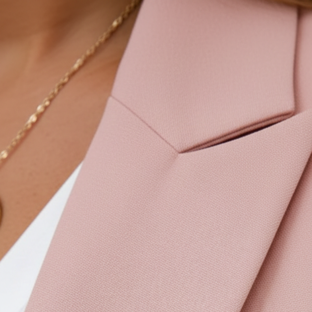 Elegant women's two-piece outfit: tailored blazer with ruched sleeves & comfy jogger pants. Business casual.