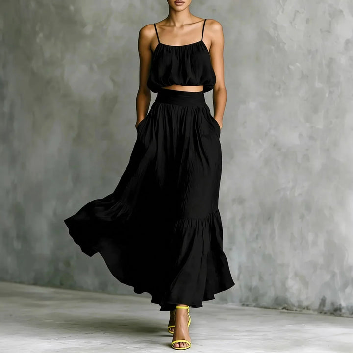 Casual women's resort wear matching set: ruffle crop top & high-waisted flowy maxi skirt, perfect for holidays.
