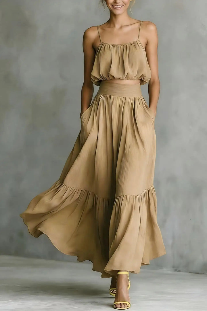 Summer women's outfit: stylish ruffle crop top and long flowy maxi skirt set, ideal for beach or vacation.