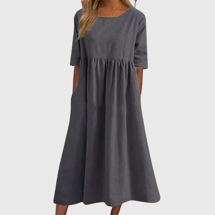 Beautiful women's short-sleeved dress. Elegant yet casual, perfect for versatile everyday or party style.
