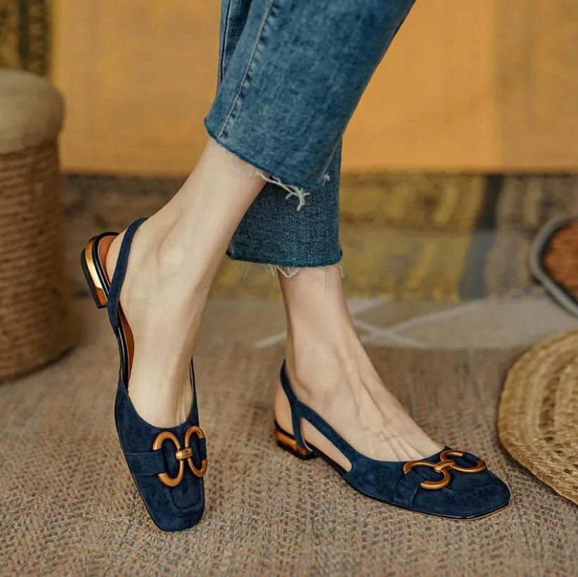 Chic women's slingback flats in dark blue, designed for all-day ergonomic comfort and versatile style.