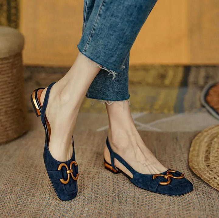 Chic women's slingback flats in dark blue, designed for all-day ergonomic comfort and versatile style.