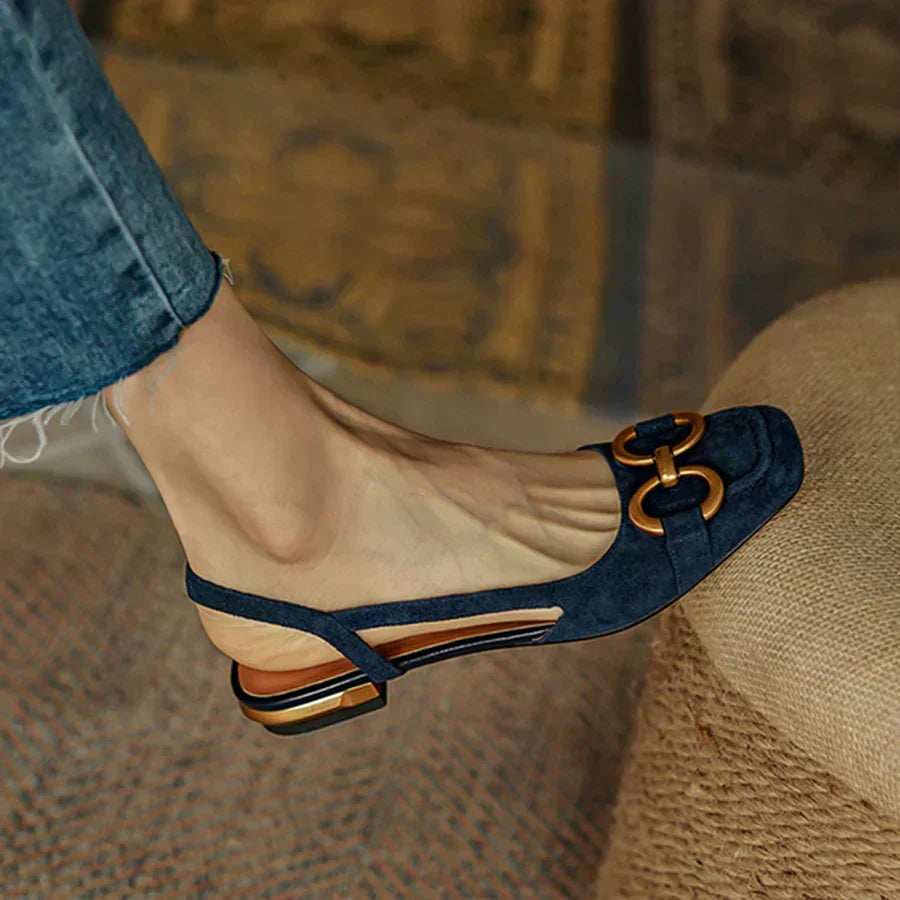 Stylish beige women's slingback flats with an ergonomic design, perfect for work or casual wear.