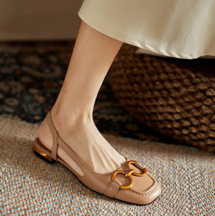 Elegant dark blue women's slingback flats, offering ergonomic comfort and a stylish, versatile look.