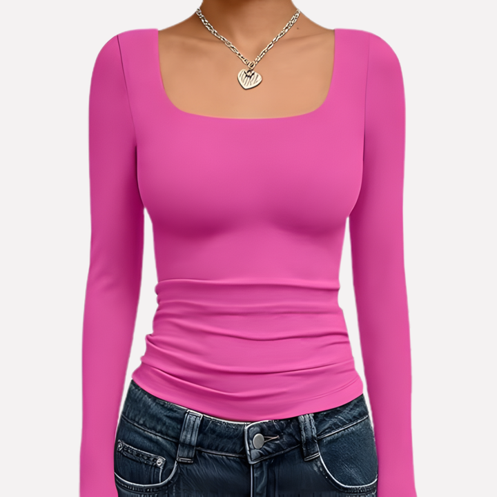 Fashionable women's solid crop top. Square neck & long sleeves offer a chic, modern casual style.