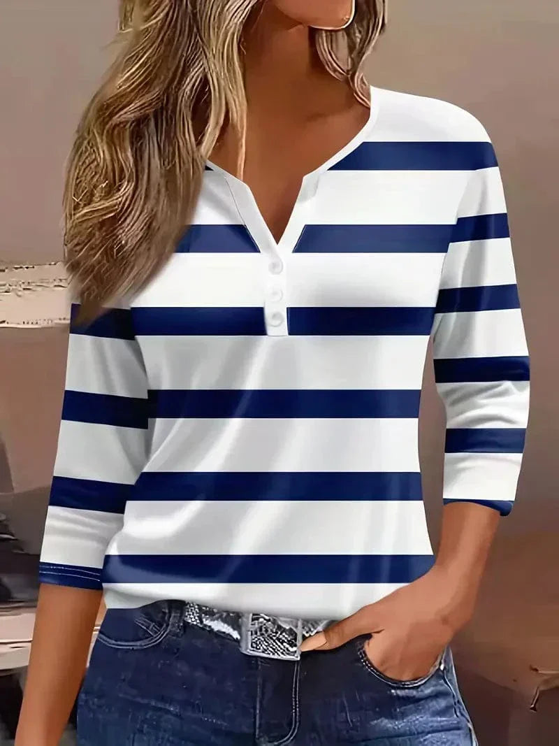Fashionable V-neck striped top for women, featuring three-quarter sleeves, great for chic spring & summer fashion.