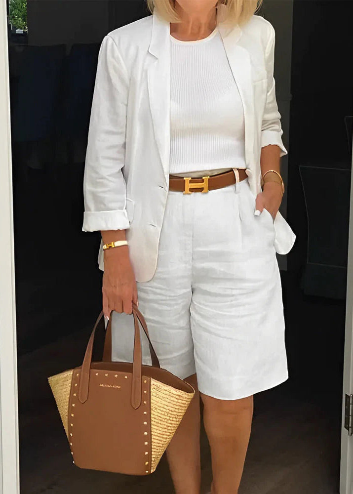 Chic women's tailored three-piece set: blazer, sleeveless top, and knee shorts. Perfect for smart casual summer workwear.