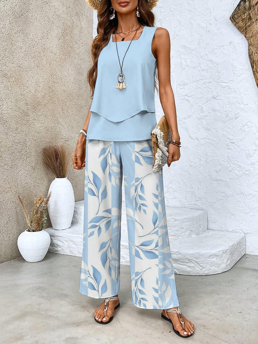 Chic women's two-piece summer set with a flowy top and elegant wide-leg pants. Perfect for casual or vacation wear.