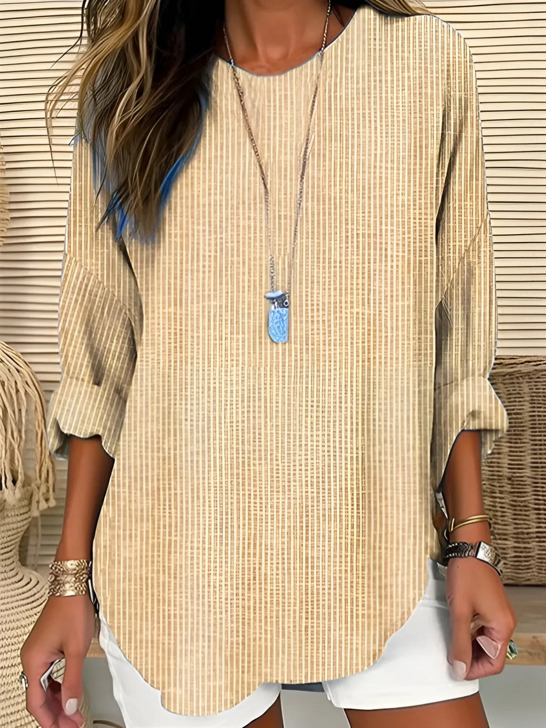 Elegant women's long sleeve striped top featuring a round neck, suitable for both office and casual fashion.