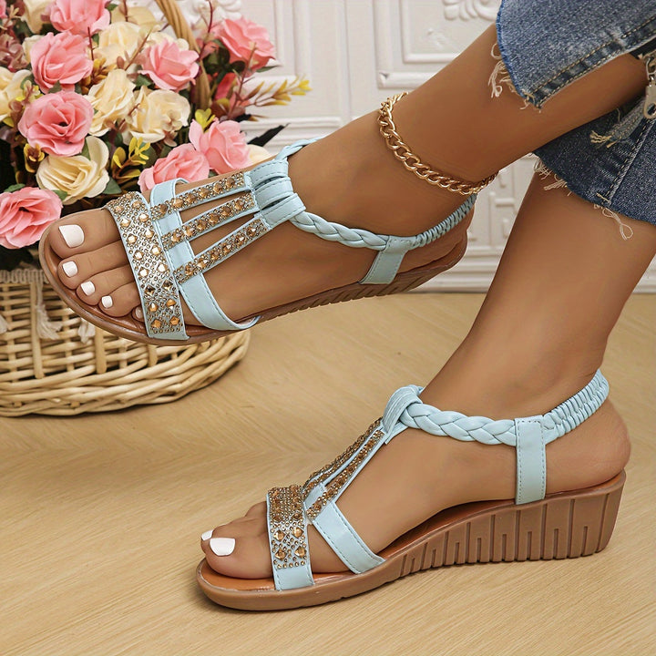 Chic women's woven sandals, adorned with sparkling rhinestones for a stylish summer look.