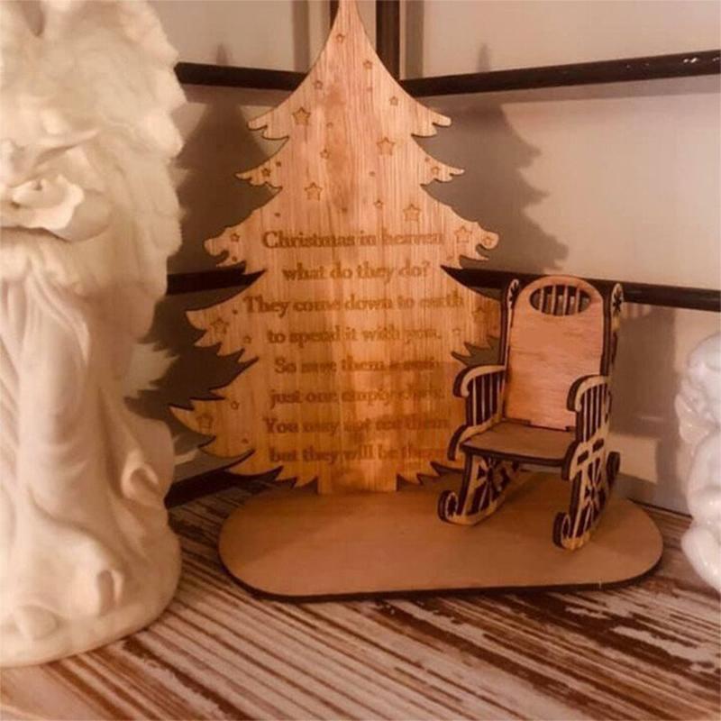 Detailed close-up of a Christmas memorial ornament, showing intricate 'feather' texture on angel wings.