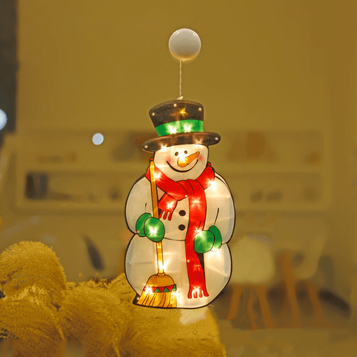 Various Christmas Window Suction Cup LED Lights arranged creatively on a large window pane, unique holiday style