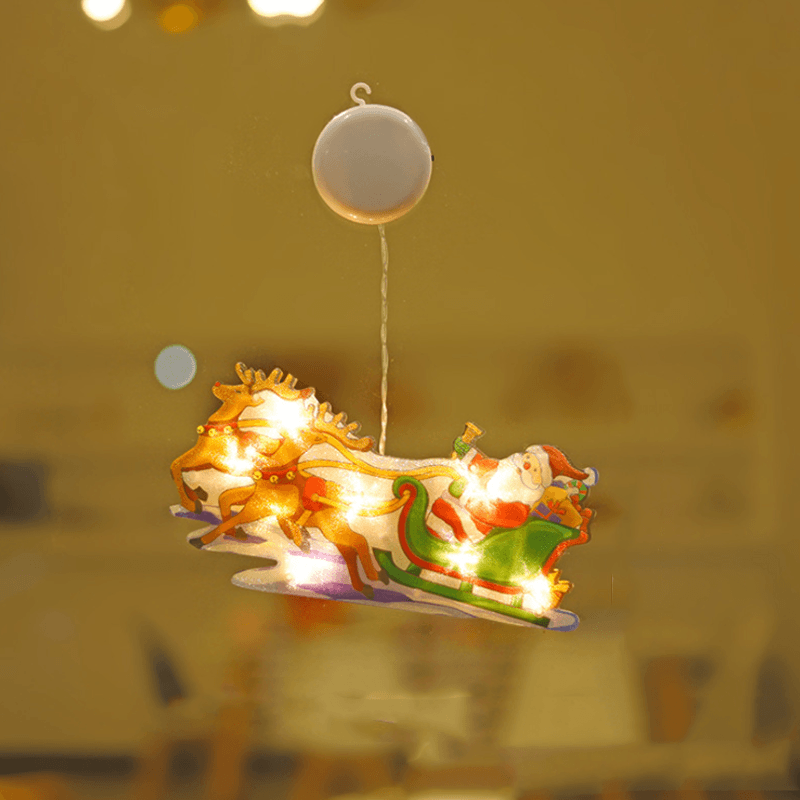 Bright Christmas LED star light with suction cup, illuminating a window, perfect for holiday festive displays