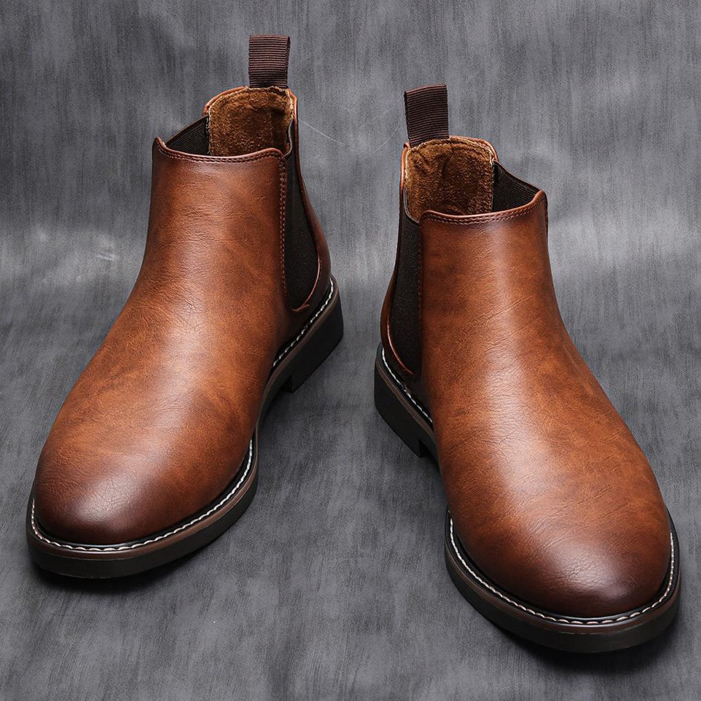 Classic black leather men's Chelsea boots, slip-on style, for versatile dress or casual wear.