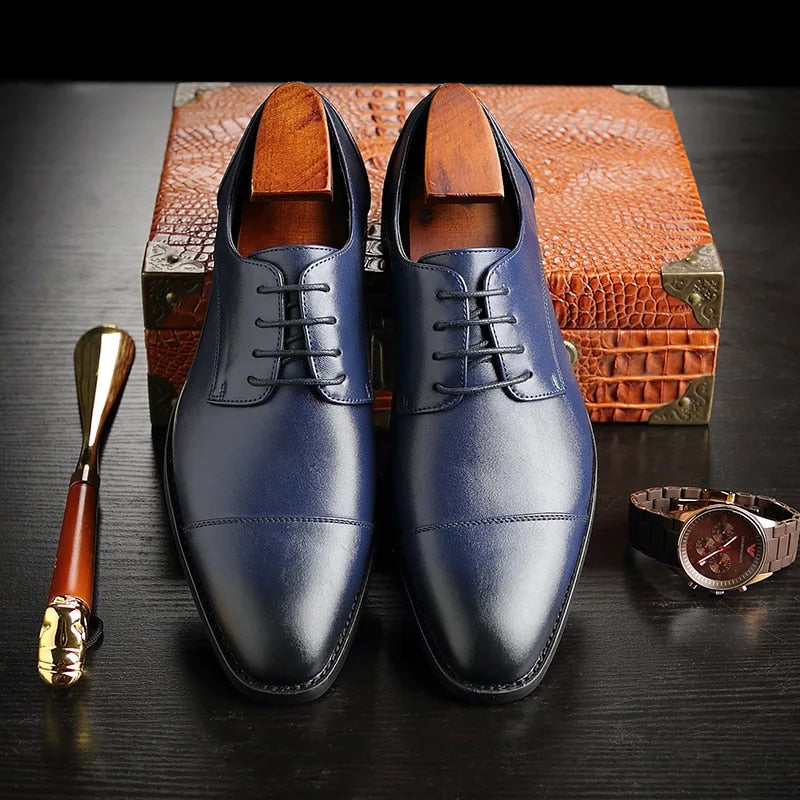 Stylish men's Oxford dress shoes, essential formal footwear for a sharp, classic business or smart casual look.