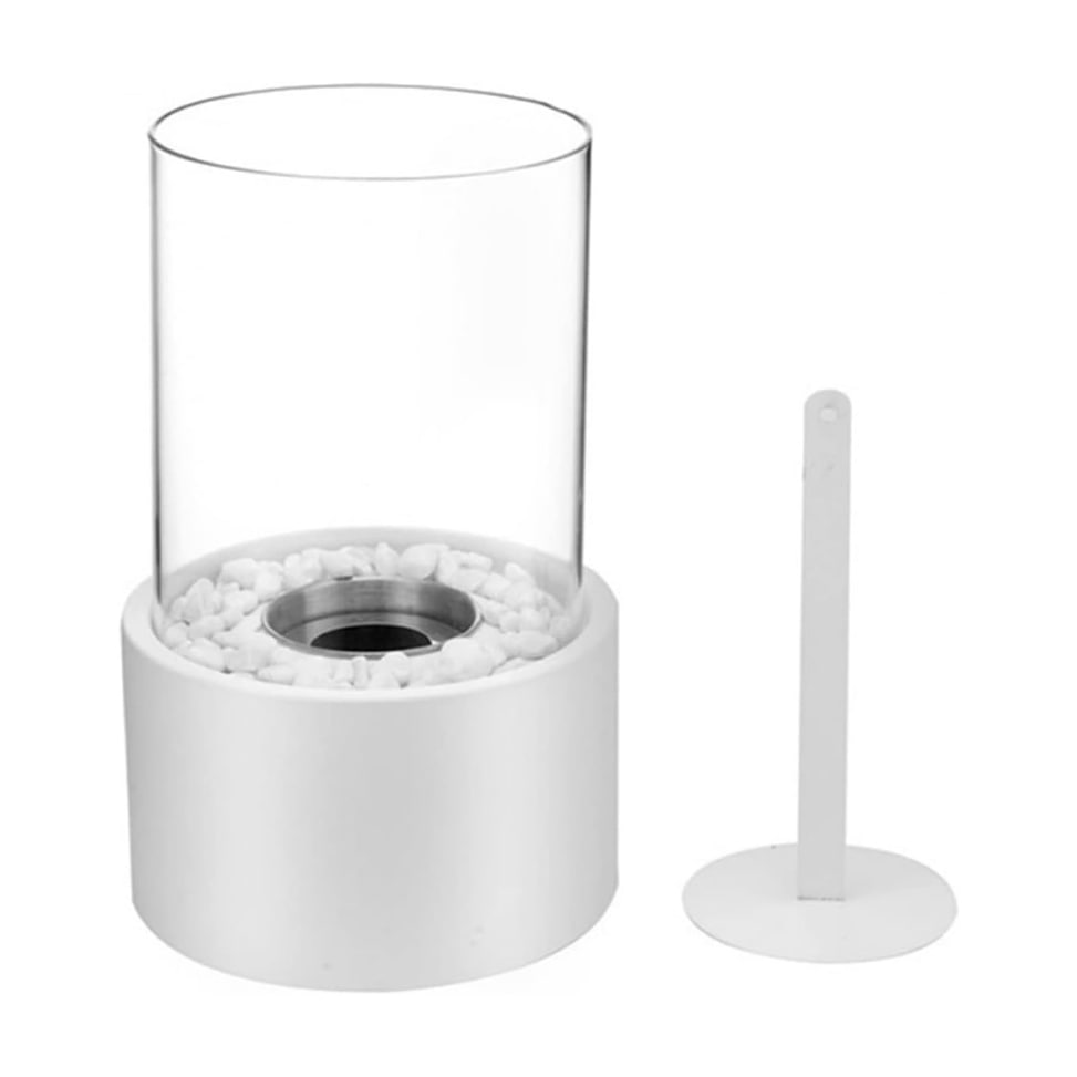 Classic metal oil lamp with a clear glass chimney, providing elegant ambient indoor lighting.