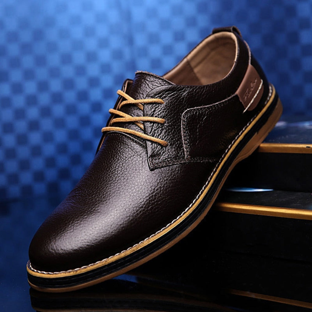 Classic men's black leather Oxford dress shoes for formal events & business attire. Comfortable lace-up design.