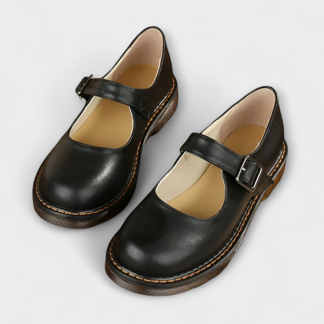Comfortable brown Mary Jane flats for women with a secure buckle strap and rounded toe design, ideal for daily wear.