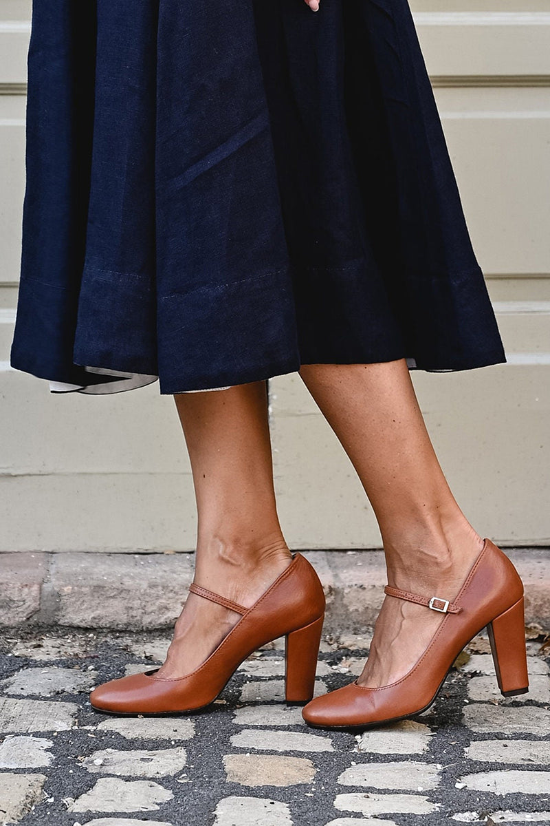 Stylish women's Mary Jane heels. Features a comfortable block heel, rounded toe, and elegant strap detail.