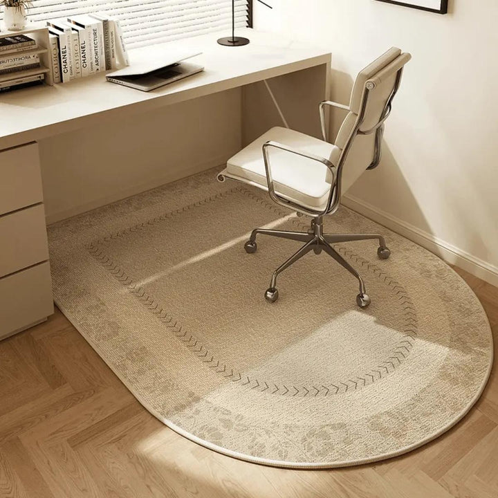Clear office chair mat protecting a hard floor, ensuring smooth rolling for desk chairs in a workspace.