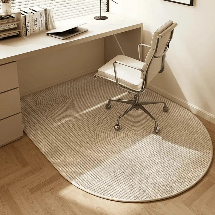 Ergonomic clear chair mat for a workspace, designed for smooth movement of rolling office chairs over carpet.
