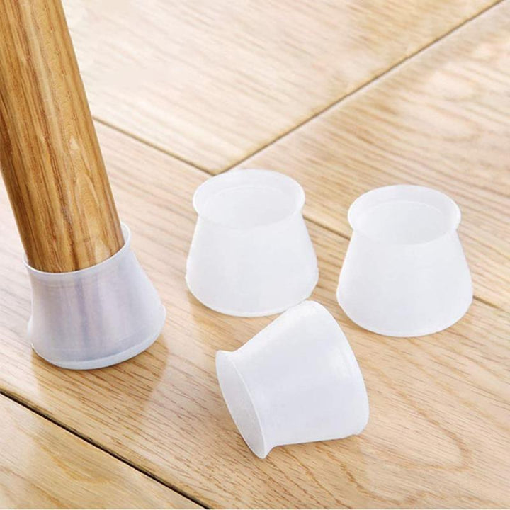 Home improvement solution: transparent silicone chair leg caps protecting a polished floor from scratches.