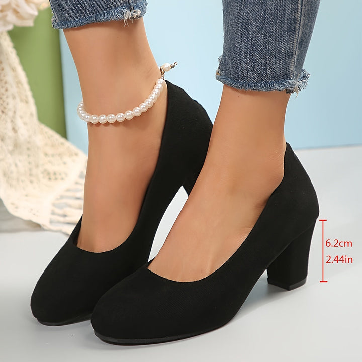 Close-up of stylish black orthopedic heels for women, featuring arch support & stable heel for comfort.