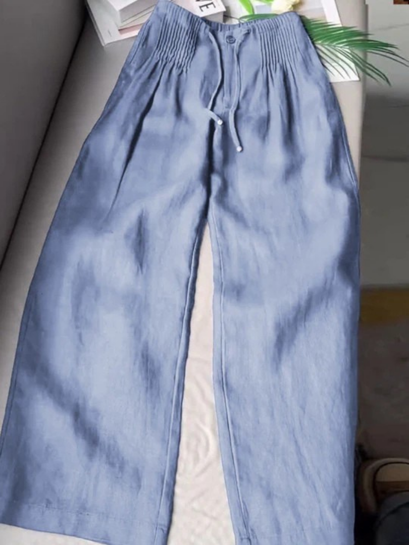 Full shot of model wearing chic women's wide-leg trousers with elastic waist for effortless style.