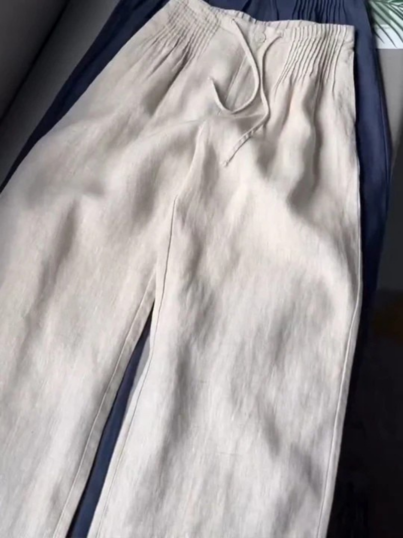 Relaxed fit women's flowy pants, showcasing the comfortable elastic waist & stylish wide-leg cut.