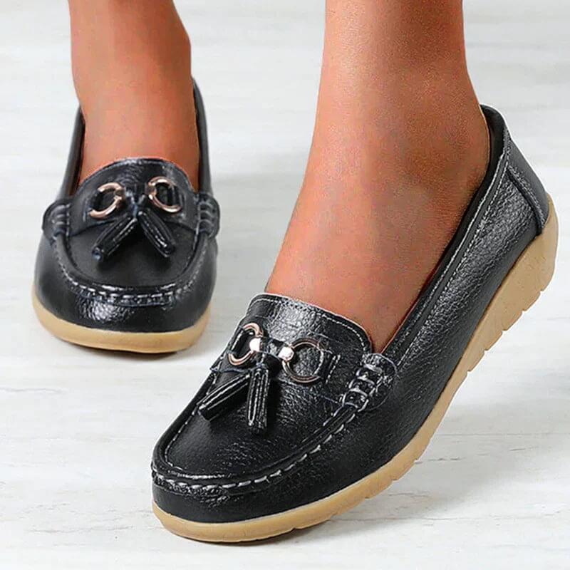 Stylish brown women's slip-on flats, providing foot support and comfort for walking.