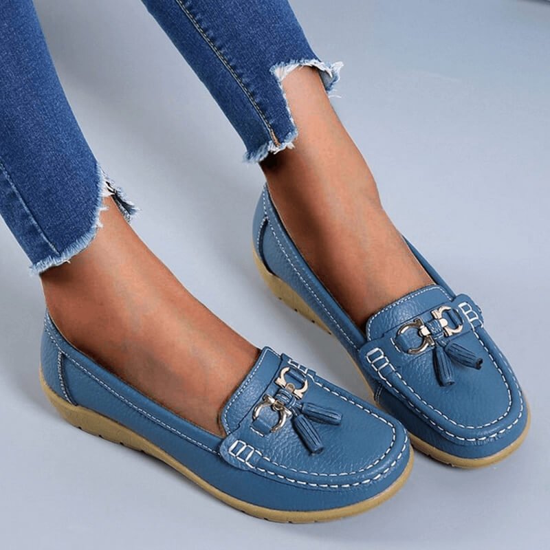 Woman wearing orthopedic comfort loafers, demonstrating ease of slip-on and casual style.