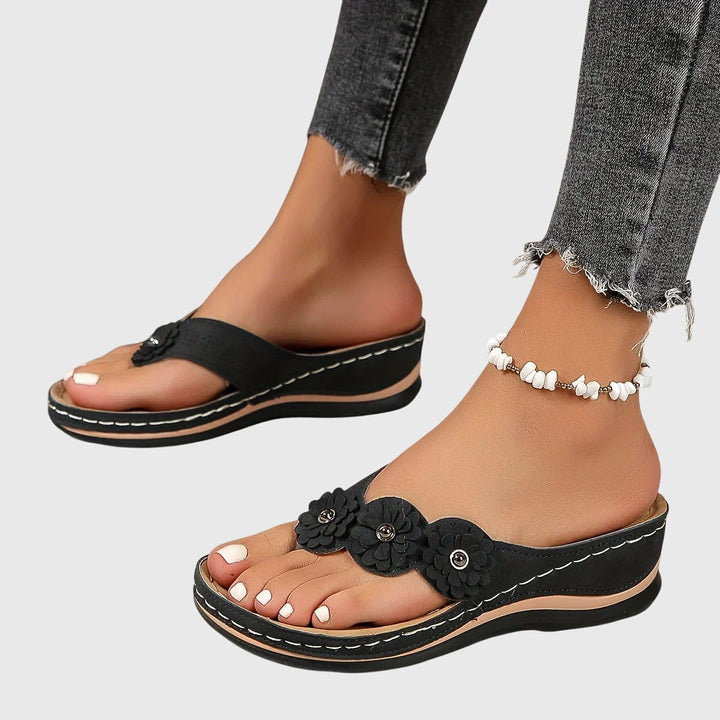 View of women's summer sandals, designed as orthopedic flip flops for ultimate arch support.