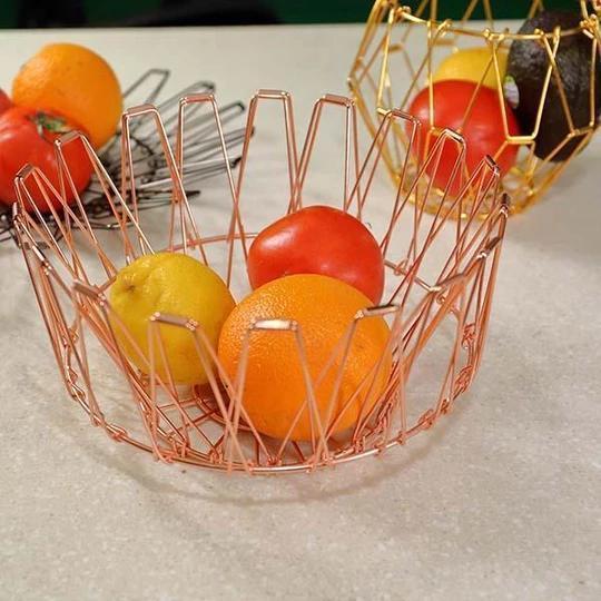 Rose gold stainless steel fruit basket, collapsible design for easy storage & stylish home decor.