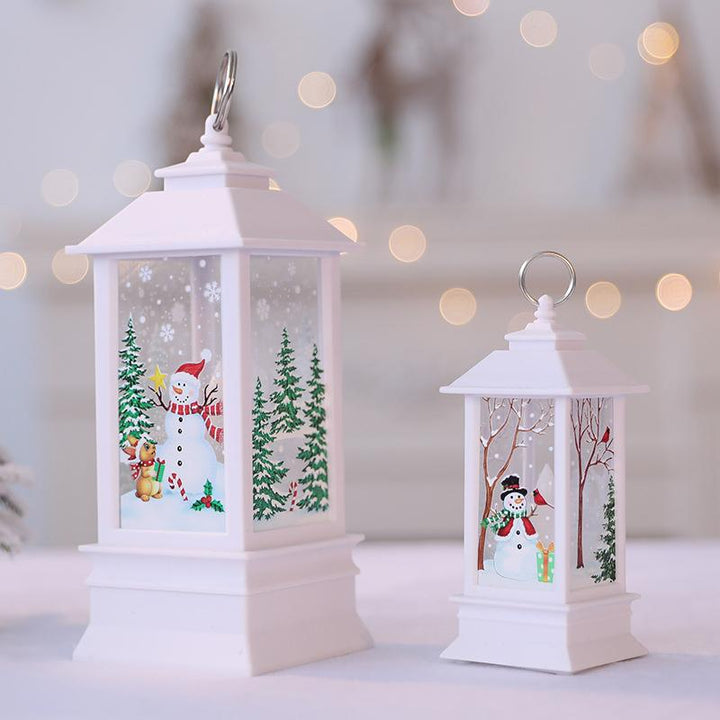 Holiday display with multiple color changing LED glitter Christmas candles