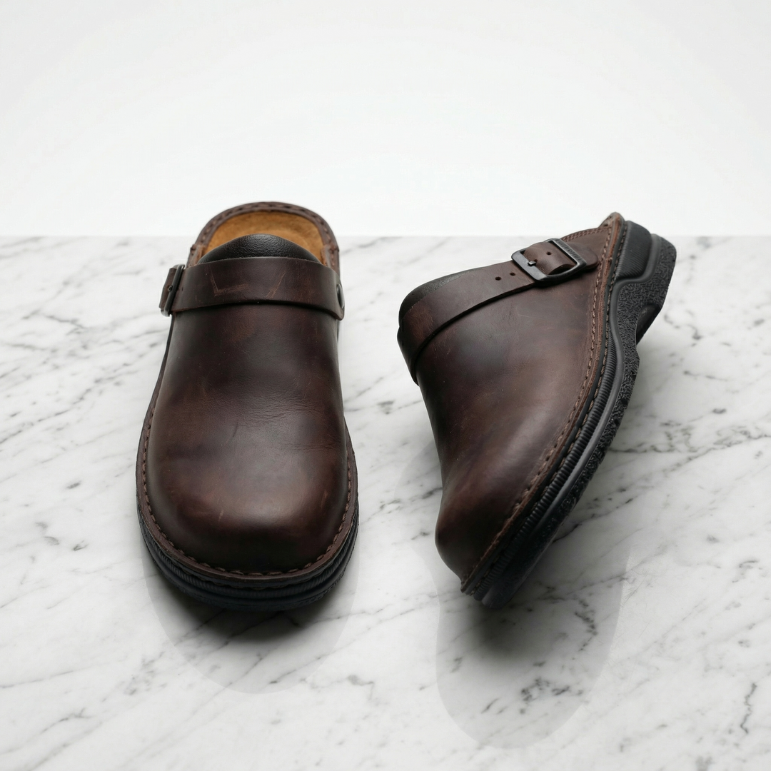 Comfortable dark brown unisex slip-on clogs. Ideal supportive footwear for stylish everyday casual wear.