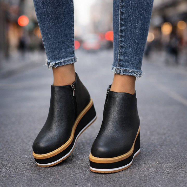 Close-up of women's vegan leather platform shoes, highlighting the comfortable wedge design