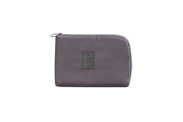 Compact waterproof electronics & cable organizer in cactus, keeping all your travel tech essentials secure.