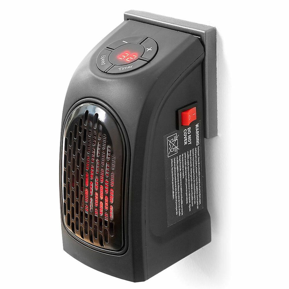 Sleek electric plug-in heater on an office desk, providing targeted warmth with an adjustable thermostat.